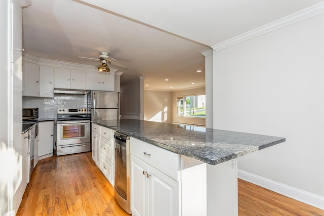 20 Karen Rd, Danbury, CT 06811 - kitchen with appliances with stainless steel finishes, light wood-style flooring, under cabinet range hood, white cabinetry, and crown molding