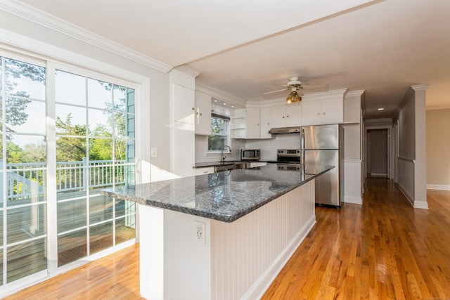 20 Karen Rd, Danbury, CT 06811 - kitchen featuring stainless steel appliances, open shelves, plenty of natural light, ceiling fan, and crown molding