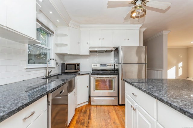 20 Karen Rd, Danbury, CT 06811 - kitchen with appliances with stainless steel finishes, under cabinet range hood, crown molding, white cabinets, and light wood-style flooring