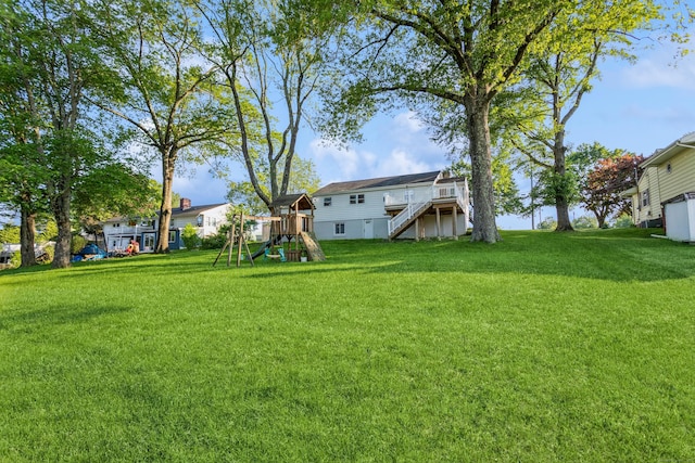 20 Karen Rd, Danbury, CT 06811 - view of grassy yard with a playground, stairway, and a wooden deck