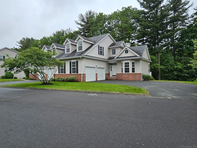17 Marble Faun Ln Unit 17, Windsor, CT 06095 - view of front of property featuring brick siding, driveway, and a front lawn