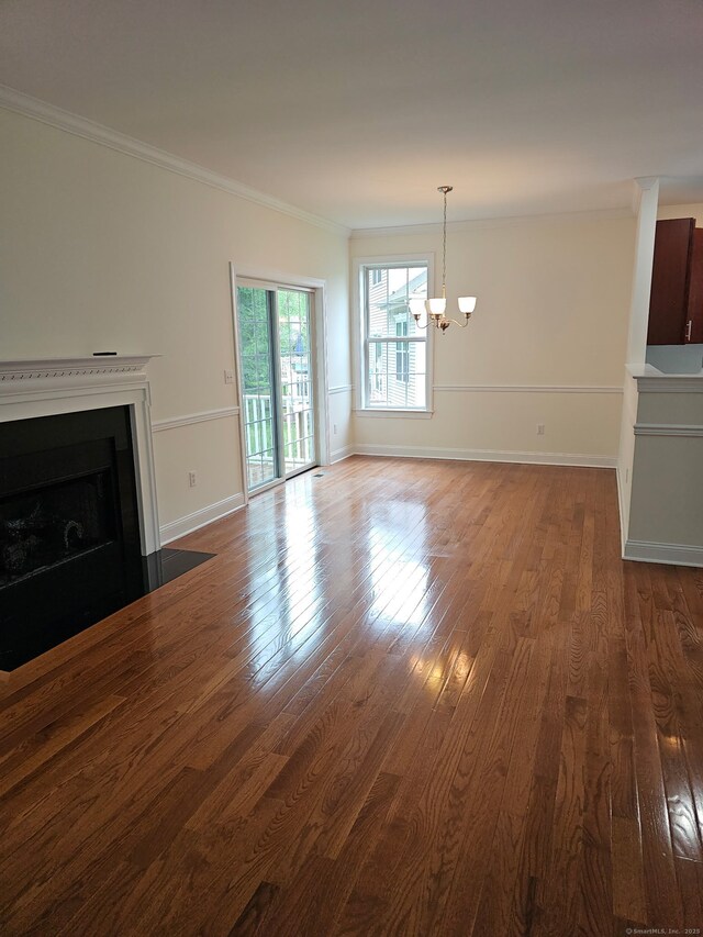 17 Marble Faun Ln Unit 17, Windsor, CT 06095 - unfurnished living room featuring a chandelier, dark wood finished floors, a fireplace with flush hearth, ornamental molding, and baseboards