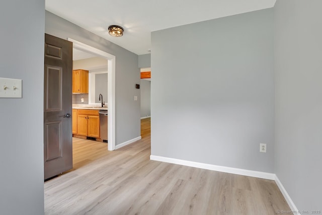 2 Edgehill Ct Unit 2, Woodbury, CT 06798 - unfurnished room featuring a sink, light wood-style flooring, and baseboards