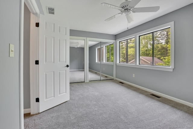 2 Edgehill Ct Unit 2, Woodbury, CT 06798 - unfurnished bedroom with carpet, baseboards, two closets, and ceiling fan