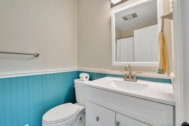 2 Edgehill Ct Unit 2, Woodbury, CT 06798 - bathroom with a wainscoted wall, vanity, and toilet
