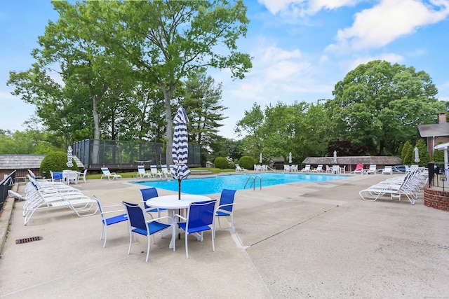 116 Southport Woods Dr, Fairfield, CT 06890 - community pool featuring a patio and view of scattered trees