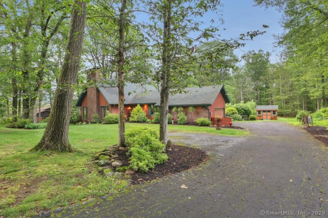 846 Arbutus St, Middletown, CT 06457 - view of front of home with a front yard, curved driveway, and a chimney