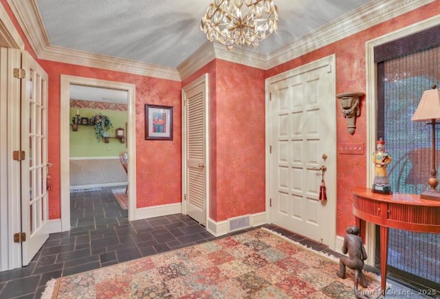 846 Arbutus St, Middletown, CT 06457 - foyer featuring a chandelier, stone finish flooring, and ornamental molding