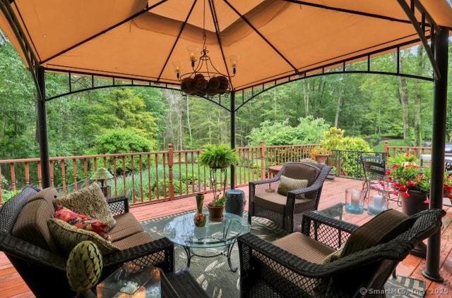 846 Arbutus St, Middletown, CT 06457 - wooden deck featuring a gazebo, an outdoor hangout area, and a forest view