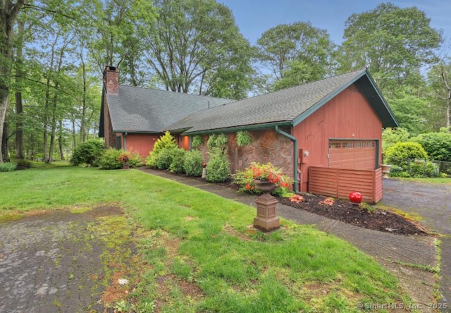 846 Arbutus St, Middletown, CT 06457 - view of front of property with an attached garage, a chimney, a front lawn, asphalt driveway, and stone siding