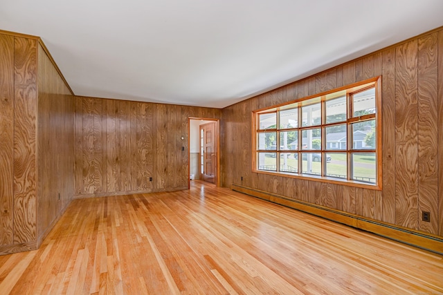 66 Hobby Dr, Ridgefield, CT 06877 - empty room with a baseboard radiator, wood walls, and wood finished floors