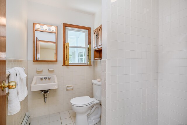 66 Hobby Dr, Ridgefield, CT 06877 - bathroom with tile walls, toilet, a sink, tile patterned flooring, and a baseboard heating unit