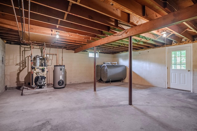 66 Hobby Dr, Ridgefield, CT 06877 - below grade area with oil tank, water heater, and a heating unit