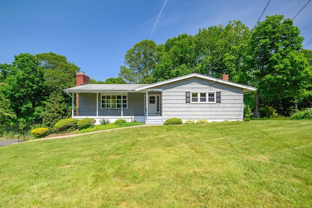 66 Hobby Dr, Ridgefield, CT 06877 - ranch-style home featuring a chimney, covered porch, and a front lawn