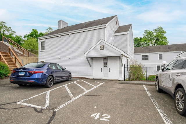 55 Mill Plain Rd Unit 34-14, Danbury, CT 06811 - uncovered parking lot featuring stairway