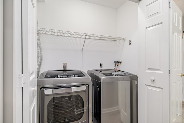55 Mill Plain Rd Unit 34-14, Danbury, CT 06811 - laundry room featuring separate washer and dryer