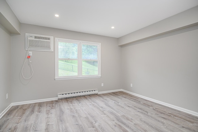 55 Mill Plain Rd Unit 34-14, Danbury, CT 06811 - unfurnished room featuring a baseboard radiator, a wall mounted air conditioner, light wood-type flooring, baseboards, and recessed lighting