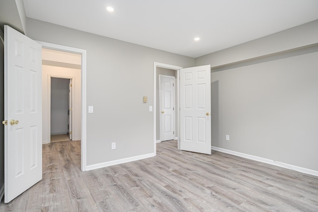 55 Mill Plain Rd Unit 34-14, Danbury, CT 06811 - unfurnished bedroom featuring light wood finished floors, recessed lighting, and baseboards