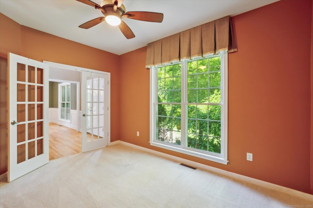 67 Bartman Rd, Haddam, CT 06441 - empty room featuring french doors, carpet floors, ceiling fan, and baseboards