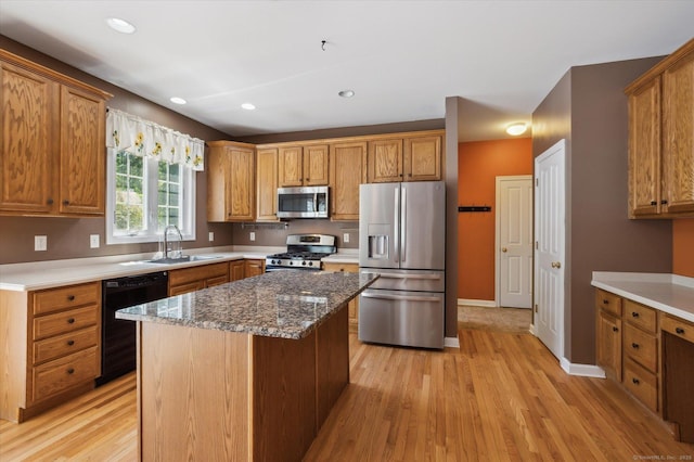 67 Bartman Rd, Haddam, CT 06441 - kitchen featuring stainless steel appliances, a sink, light wood-style floors, brown cabinetry, and recessed lighting
