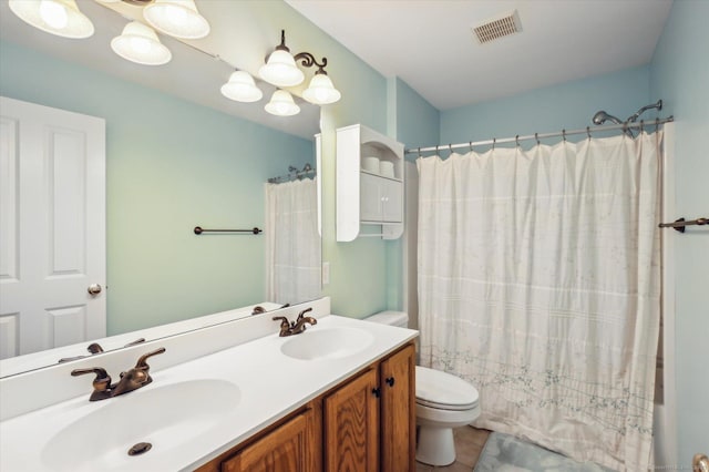 67 Bartman Rd, Haddam, CT 06441 - full bath with toilet, double vanity, tile patterned floors, and shower / bath combination with curtain