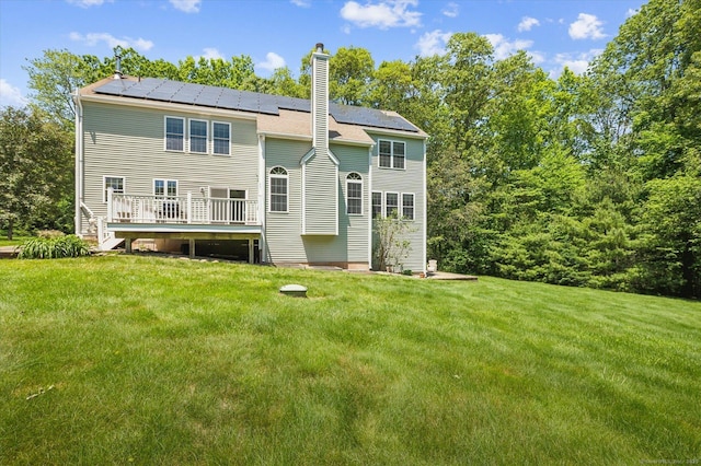 67 Bartman Rd, Haddam, CT 06441 - back of property featuring a yard, solar panels, and a chimney