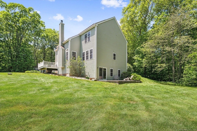 67 Bartman Rd, Haddam, CT 06441 - view of side of property with a chimney, a yard, and a wooden deck