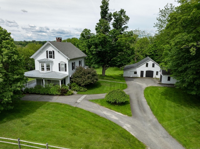 56 Sharon Rd, Salisbury, CT 06039 - view of front of house with a chimney, an outdoor structure, a front lawn, metal roof, and a standing seam roof