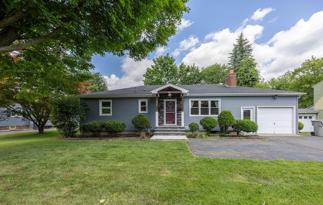 881 Pine St, Bristol, CT 06010 - ranch-style house featuring asphalt driveway, an attached garage, a chimney, and a front lawn