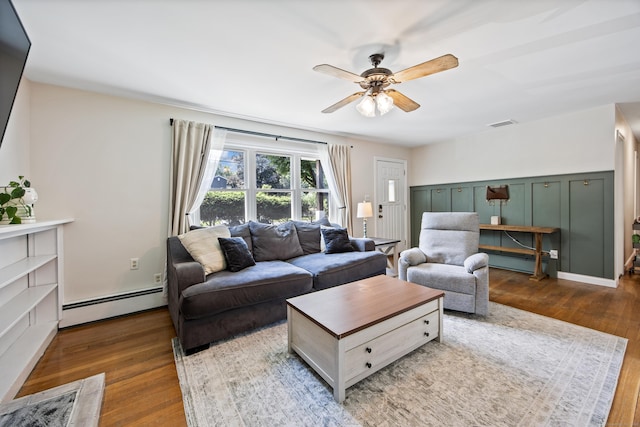 881 Pine St, Bristol, CT 06010 - living area with a baseboard radiator, wood finished floors, and ceiling fan
