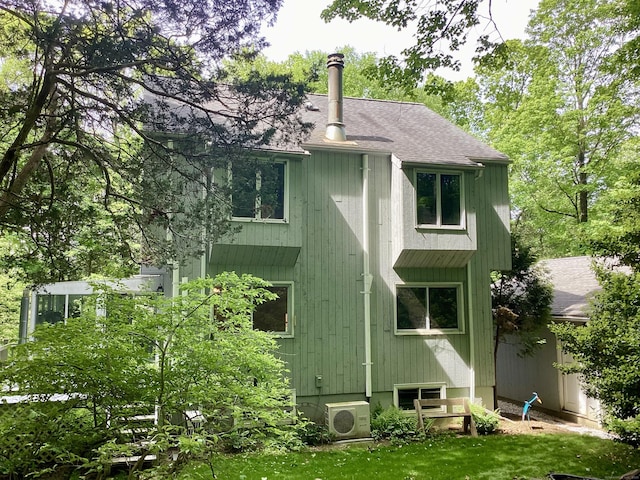 322 N St, Roxbury, CT 06783 - back of house with a cooling unit and a shingled roof