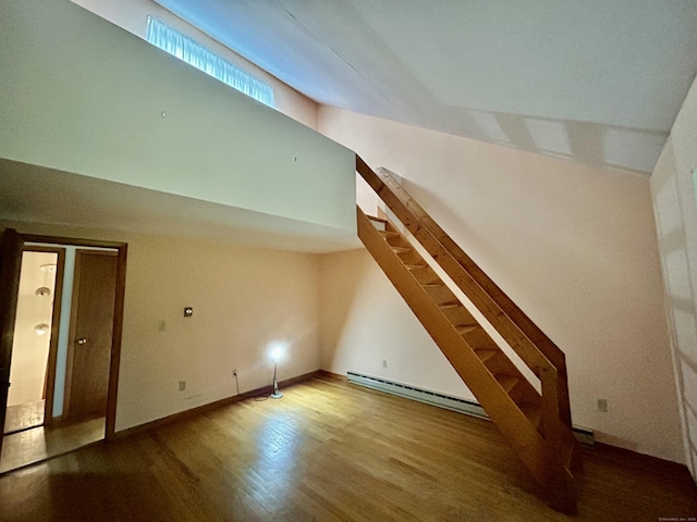 322 N St, Roxbury, CT 06783 - bonus room featuring a baseboard radiator, stairs, wood finished floors, lofted ceiling, and baseboards