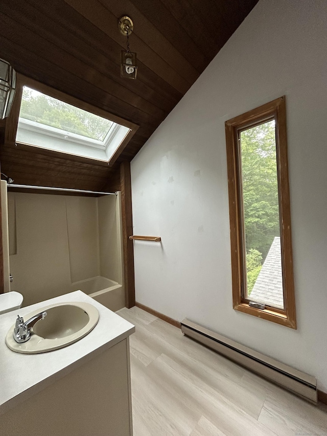 322 N St, Roxbury, CT 06783 - bathroom featuring a baseboard radiator, lofted ceiling, a skylight, wooden ceiling, and vanity