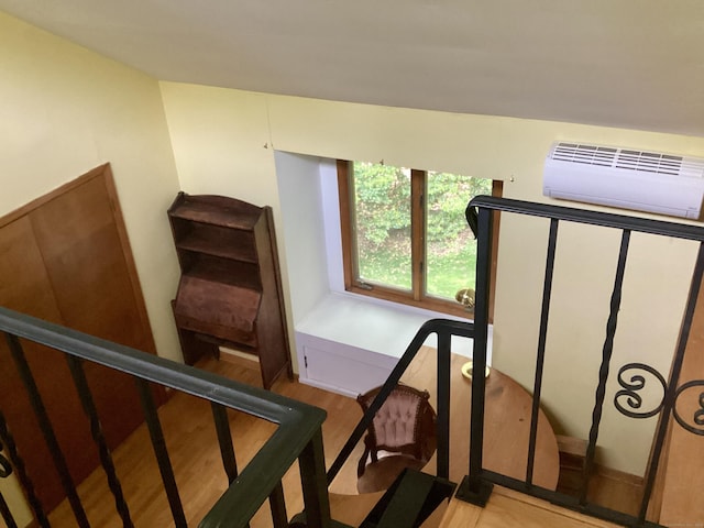 322 N St, Roxbury, CT 06783 - stairs with a wall mounted AC and wood finished floors