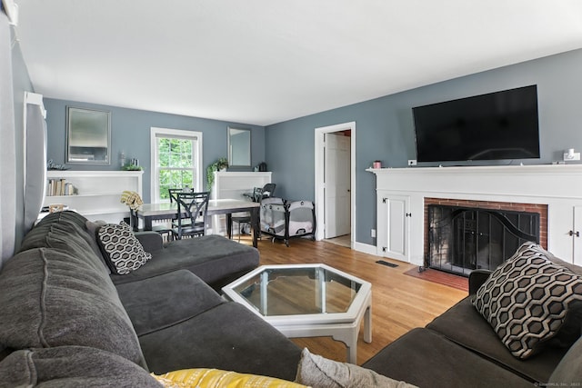 567 Bunker Hill Ave, Waterbury, CT 06708 - living room with a fireplace and wood finished floors