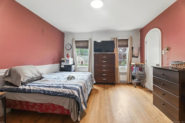 567 Bunker Hill Ave, Waterbury, CT 06708 - bedroom with radiator heating unit and light wood-style floors