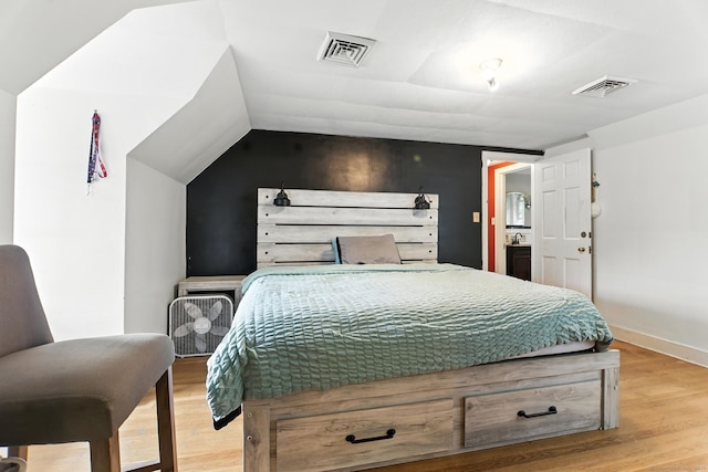 567 Bunker Hill Ave, Waterbury, CT 06708 - bedroom with light wood-type flooring and vaulted ceiling