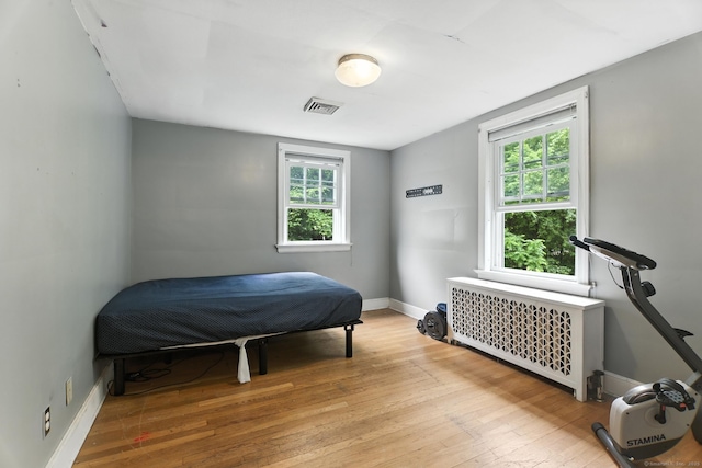567 Bunker Hill Ave, Waterbury, CT 06708 - bedroom featuring radiator and wood-type flooring