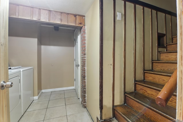 567 Bunker Hill Ave, Waterbury, CT 06708 - washroom featuring washer and clothes dryer and light tile patterned floors