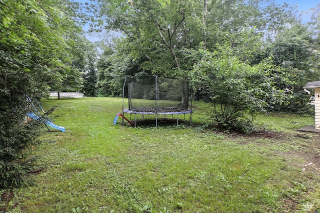 567 Bunker Hill Ave, Waterbury, CT 06708 - view of green lawn featuring a trampoline