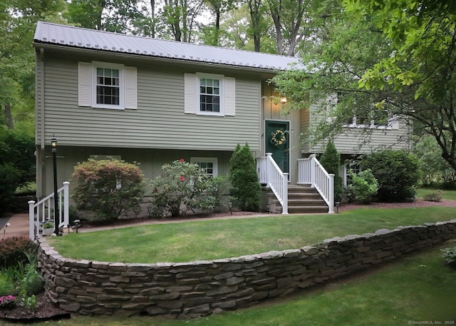 10 Brewer Rd, East Hampton, CT 06424 - bi-level home featuring metal roof and a front yard