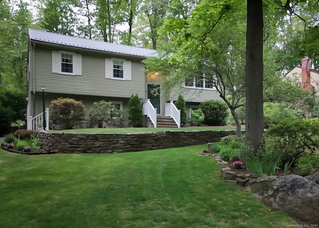 10 Brewer Rd, East Hampton, CT 06424 - bi-level home with a front yard and metal roof