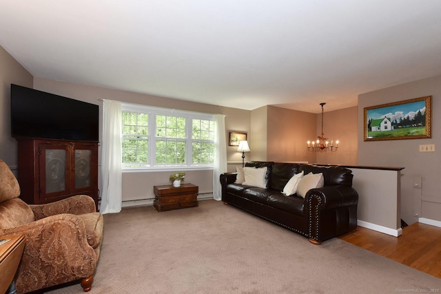 10 Brewer Rd, East Hampton, CT 06424 - living area featuring a chandelier, a baseboard heating unit, and baseboards