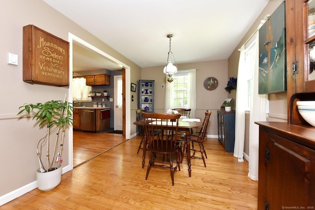10 Brewer Rd, East Hampton, CT 06424 - dining room with light wood finished floors and baseboards