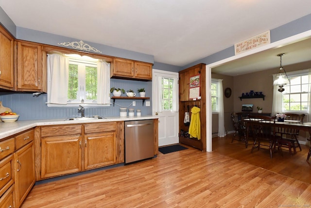 10 Brewer Rd, East Hampton, CT 06424 - kitchen featuring stainless steel dishwasher, light wood-style floors, a sink, and light countertops
