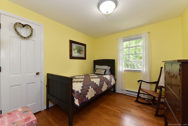 10 Brewer Rd, East Hampton, CT 06424 - bedroom with wood finished floors and a baseboard heating unit