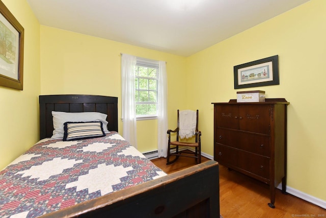 10 Brewer Rd, East Hampton, CT 06424 - bedroom featuring wood finished floors, baseboard heating, and baseboards
