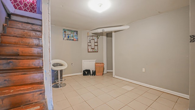 1149 Central Ave, Bridgeport, CT 06607 - finished basement featuring baseboards and light tile patterned floors