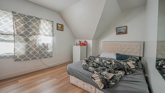 1149 Central Ave, Bridgeport, CT 06607 - bedroom with wood finished floors and lofted ceiling