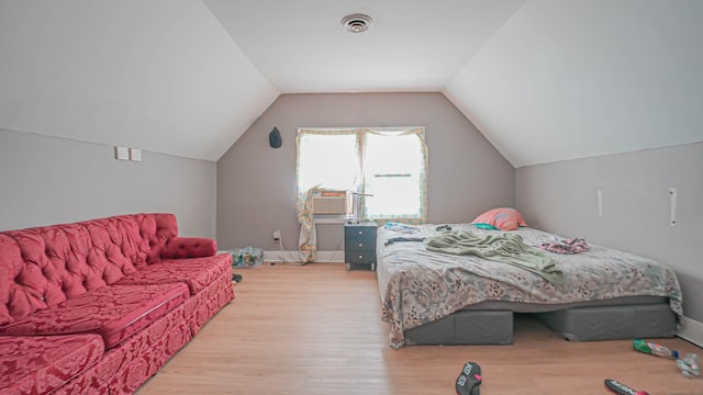 1149 Central Ave, Bridgeport, CT 06607 - bedroom featuring light wood-type flooring, lofted ceiling, and baseboards